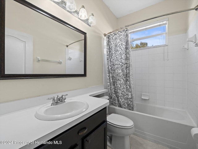 full bathroom with shower / bath combination with curtain, vanity, and toilet