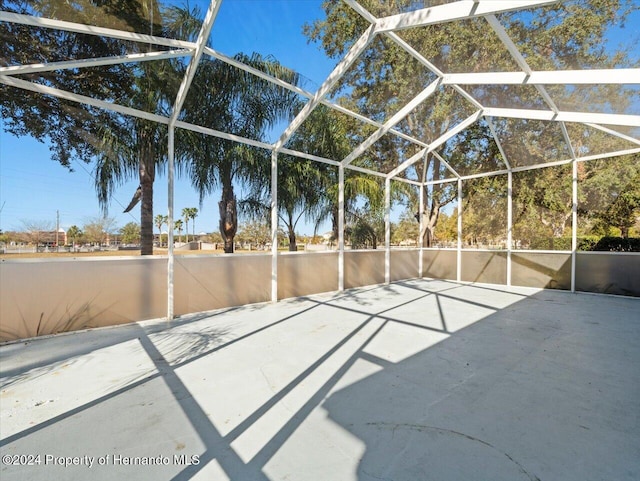 view of patio / terrace featuring glass enclosure