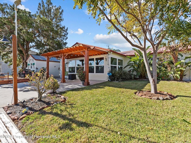 view of front of house featuring a front yard and a pergola