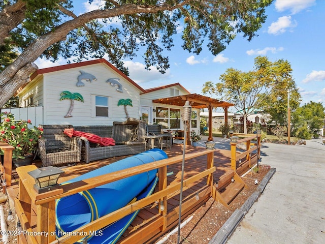 exterior space with outdoor lounge area and a pergola