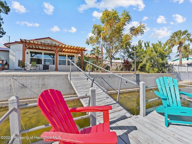 view of dock with a pergola