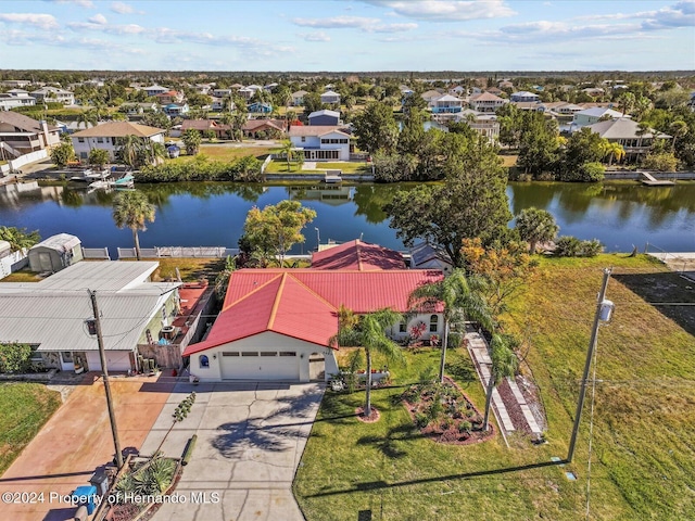 drone / aerial view with a water view