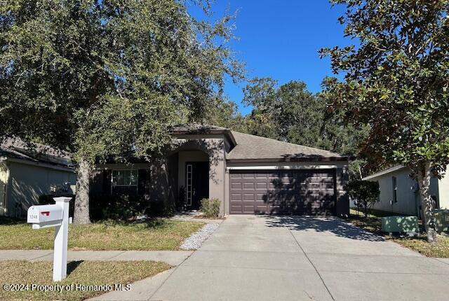 view of front of property with a garage