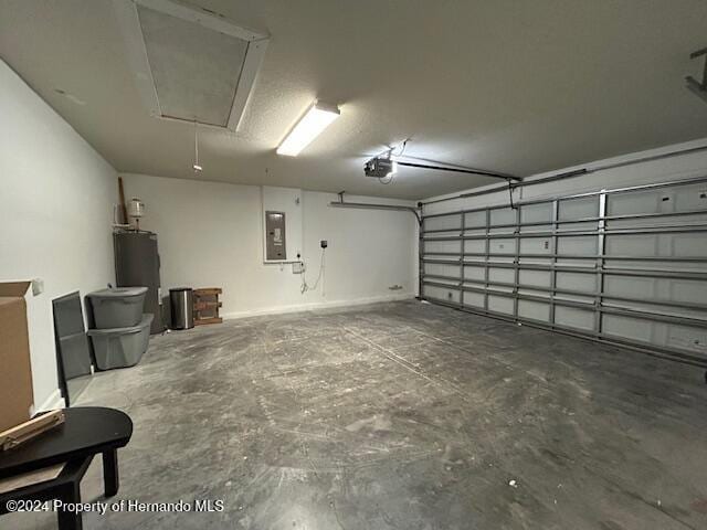 garage featuring electric panel, a garage door opener, and water heater