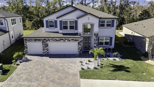 front of property featuring a garage and a front yard