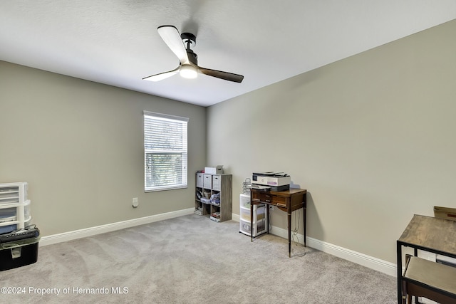 miscellaneous room featuring ceiling fan and light colored carpet