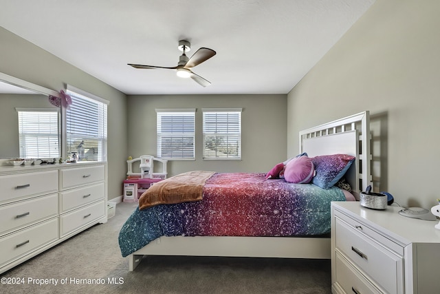 bedroom featuring light colored carpet and ceiling fan