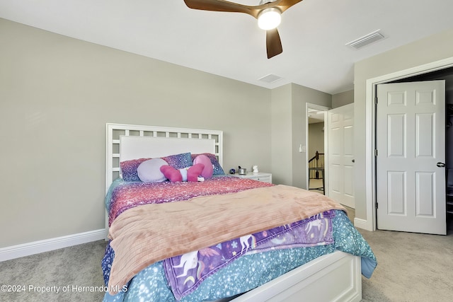 bedroom with light carpet and ceiling fan