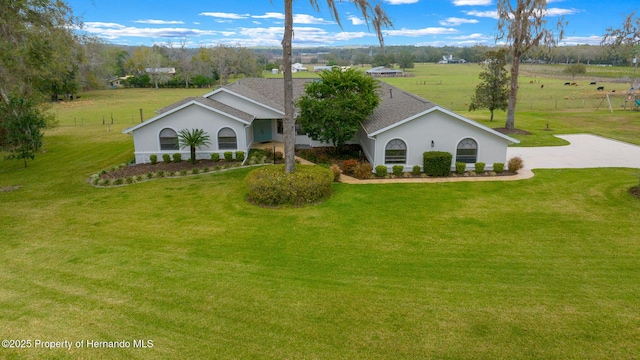 view of front of property with a rural view and a front yard