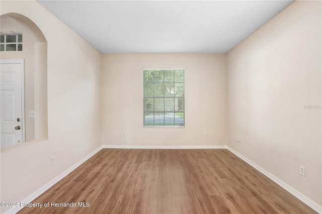 spare room with light wood-type flooring