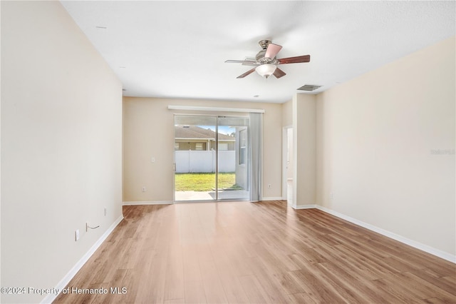 unfurnished room featuring light hardwood / wood-style flooring and ceiling fan