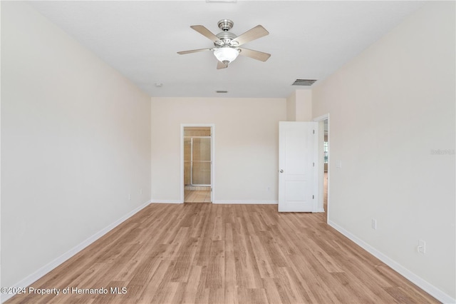 empty room with light wood-type flooring and ceiling fan