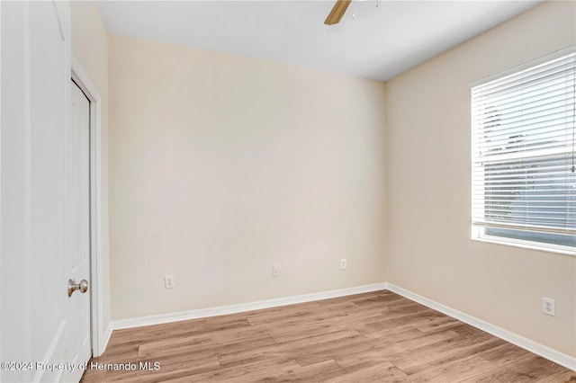 unfurnished room featuring ceiling fan and light hardwood / wood-style flooring