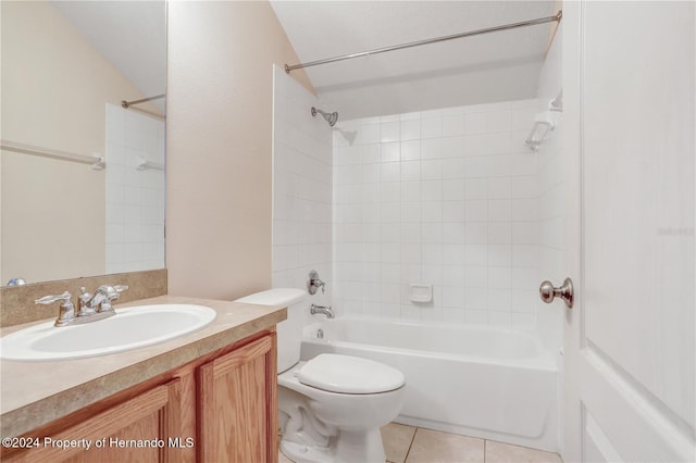 full bathroom with tiled shower / bath, tile patterned flooring, vanity, and toilet