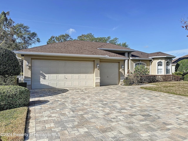 ranch-style home with a garage