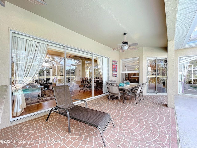 sunroom featuring a wealth of natural light and ceiling fan