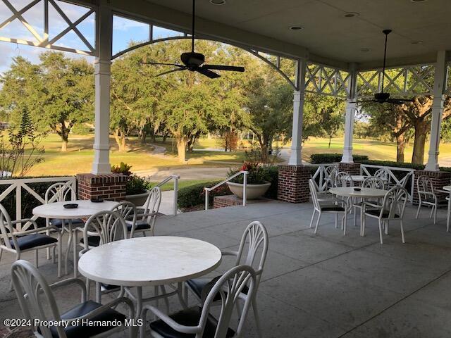 view of patio featuring ceiling fan