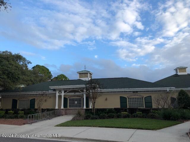 exterior space featuring a front lawn