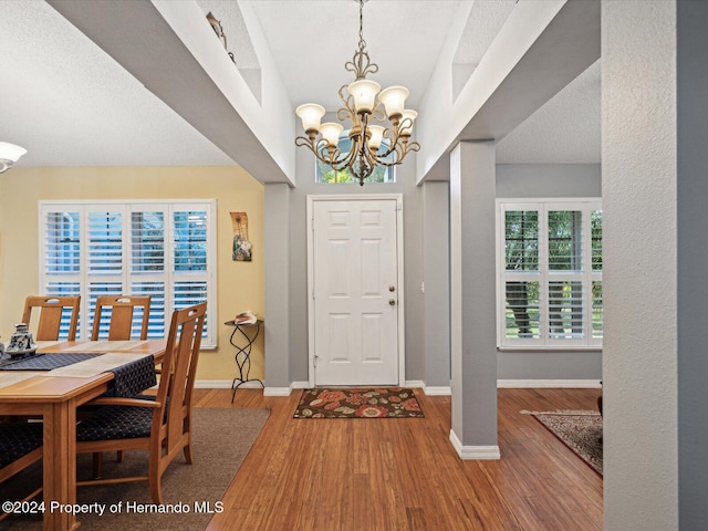 92 Randolph Ave, Spring Hill, FL 34606 - entrance foyer featuring a chandelier and wood finished floors