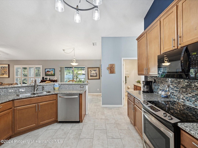 92 Randolph Ave, Spring Hill, FL 34606 - kitchen featuring stainless steel appliances, decorative backsplash, brown cabinets, light stone counters, and pendant lighting