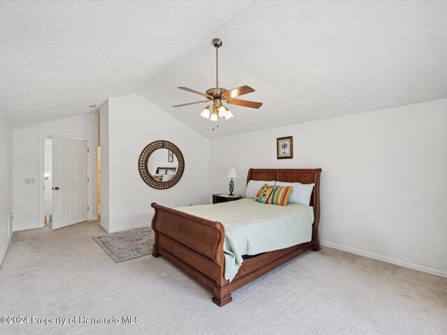 92 Randolph Ave, Spring Hill, FL 34606 - bedroom featuring carpet flooring, vaulted ceiling, and ceiling fan