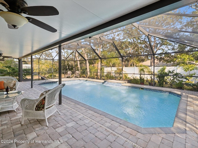 92 Randolph Ave, Spring Hill, FL 34606 - view of swimming pool with a hot tub, a patio, a ceiling fan, and glass enclosure