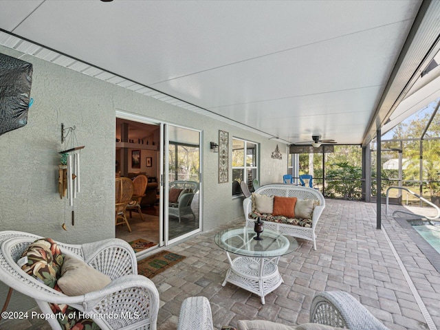 92 Randolph Ave, Spring Hill, FL 34606 - view of patio featuring ceiling fan, glass enclosure, and an outdoor living space