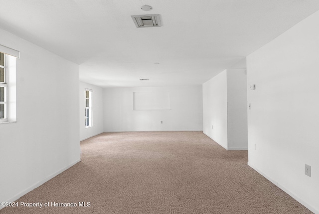 empty room with light colored carpet