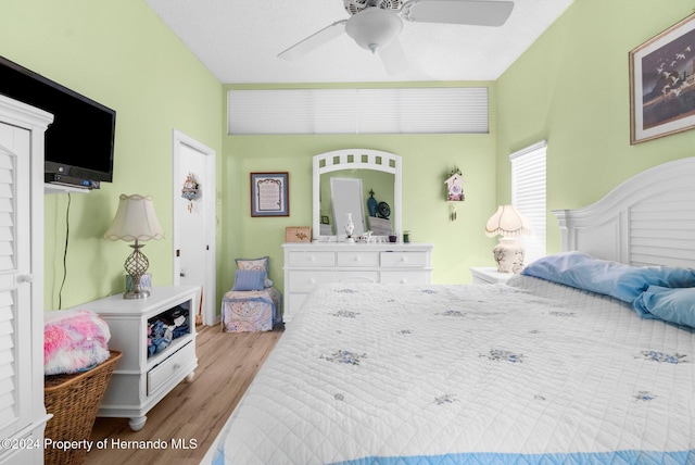 bedroom with light wood-type flooring and ceiling fan