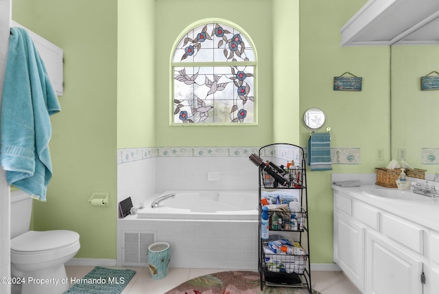 bathroom featuring vanity, tile patterned flooring, and a relaxing tiled tub