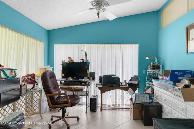 office with a textured ceiling, ceiling fan, and vaulted ceiling