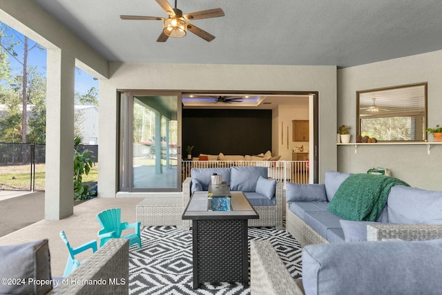 view of patio / terrace featuring an outdoor living space and ceiling fan