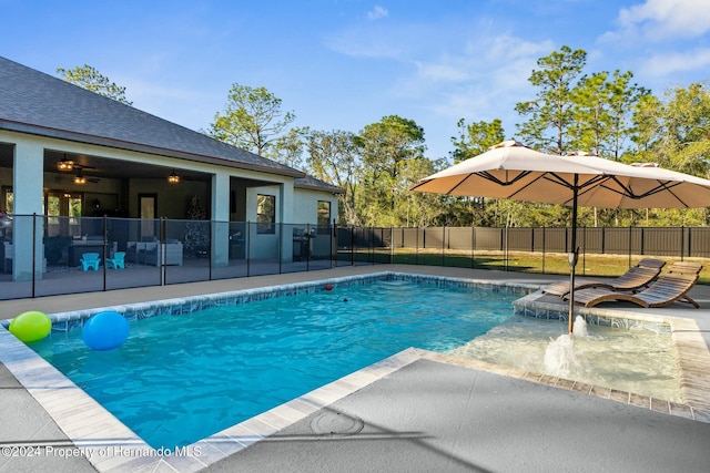 view of swimming pool with a patio area