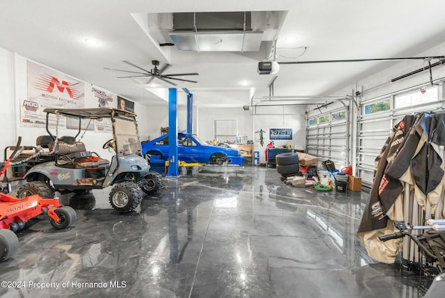 garage featuring ceiling fan and a garage door opener