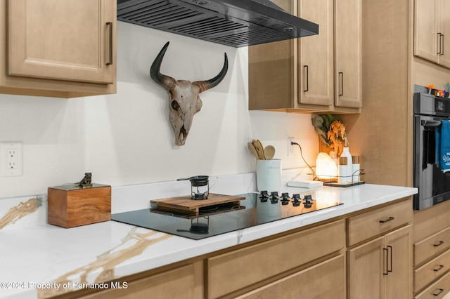 kitchen with black appliances, light brown cabinets, and exhaust hood