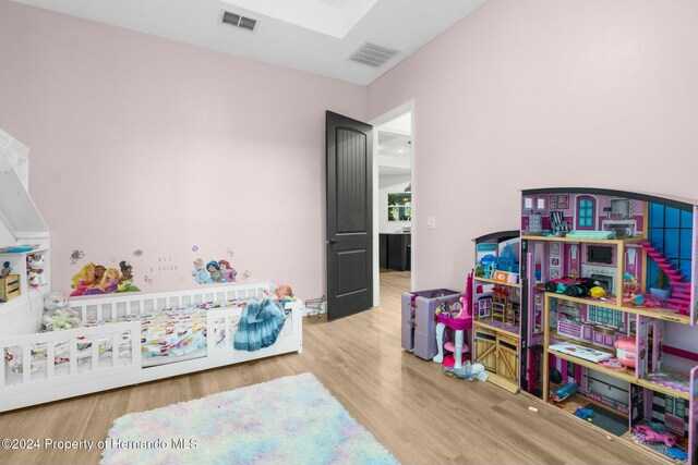 bedroom featuring wood-type flooring