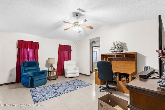 office area featuring light tile patterned floors, a textured ceiling, ceiling fan, and lofted ceiling