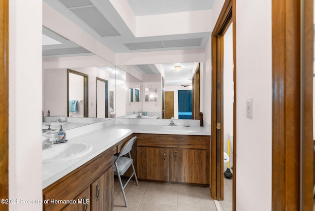 bathroom with tile patterned flooring and vanity