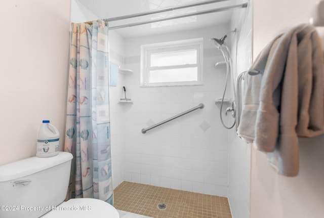 bathroom with toilet and walk in shower