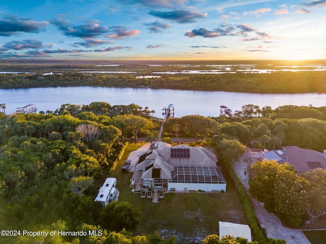 aerial view at dusk with a water view