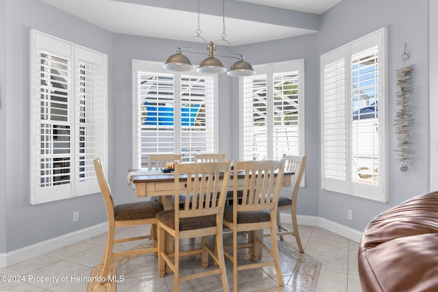 dining space featuring light tile patterned floors