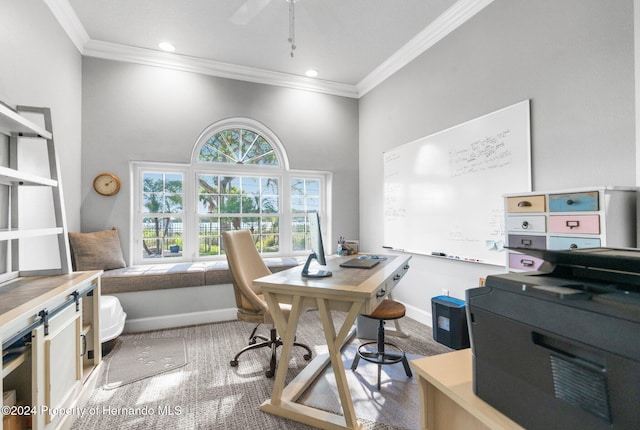 carpeted office featuring ceiling fan, ornamental molding, and a towering ceiling