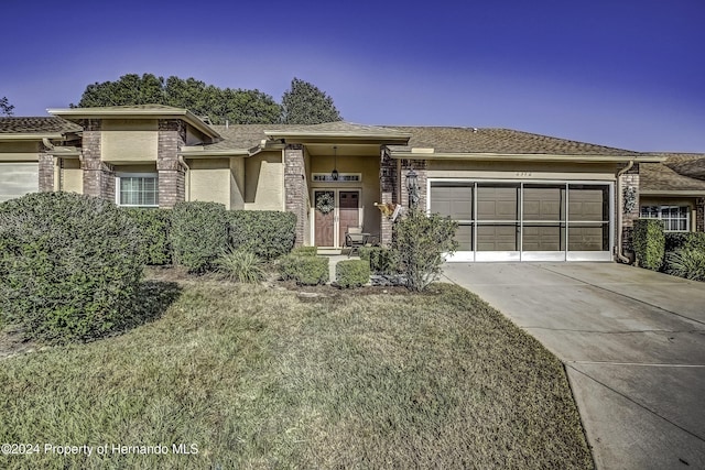 prairie-style house featuring a front yard