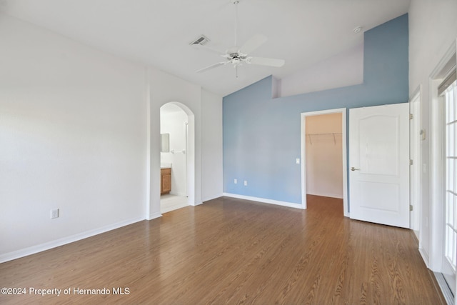 interior space featuring hardwood / wood-style floors, high vaulted ceiling, and ceiling fan