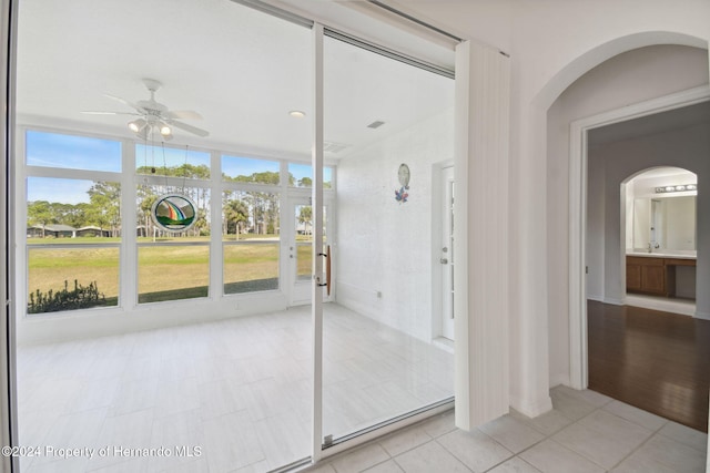 bathroom featuring tile patterned floors, ceiling fan, and plenty of natural light