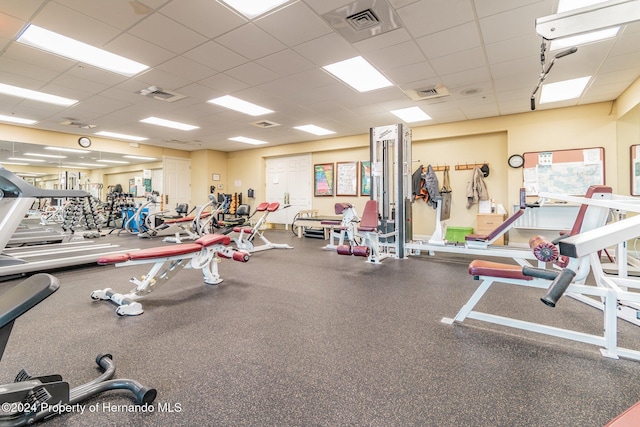 workout area with a drop ceiling