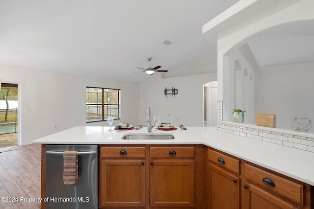 kitchen with dishwasher, light hardwood / wood-style flooring, plenty of natural light, and sink