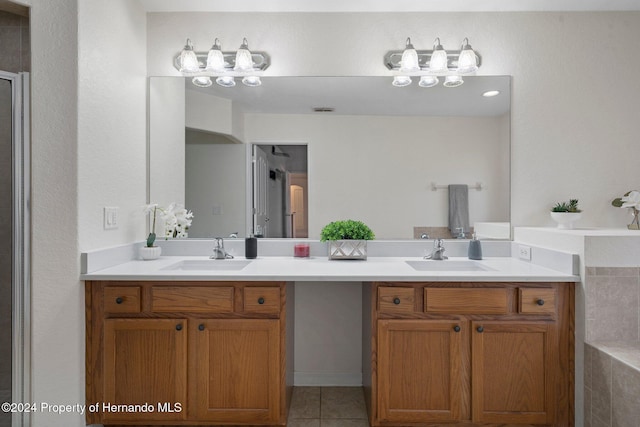 bathroom with tile patterned flooring and vanity