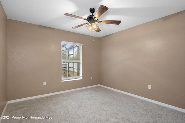 empty room with carpet and ceiling fan