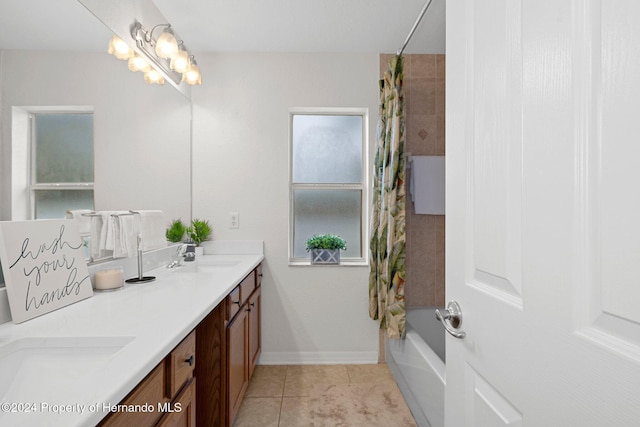 bathroom with tile patterned flooring, vanity, shower / bathtub combination with curtain, and a chandelier